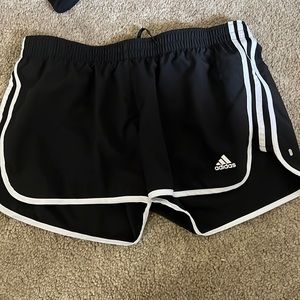 Black and white Adidas shorts.